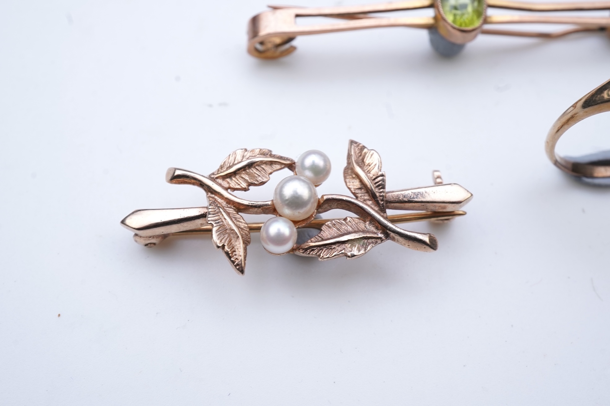 Four brooches and a gold signet ring